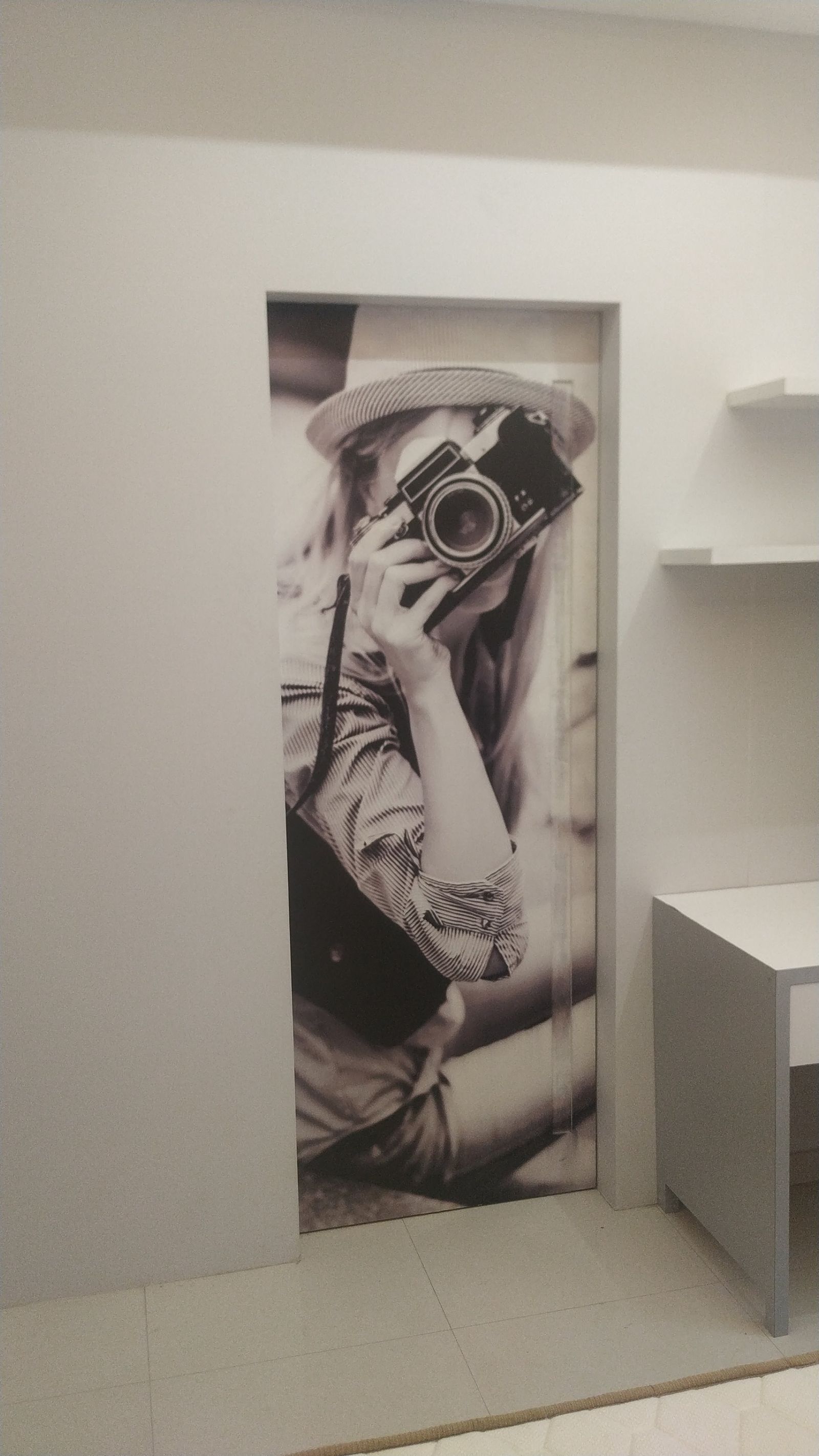 Vintage camera photo mural set into a study nook doorway