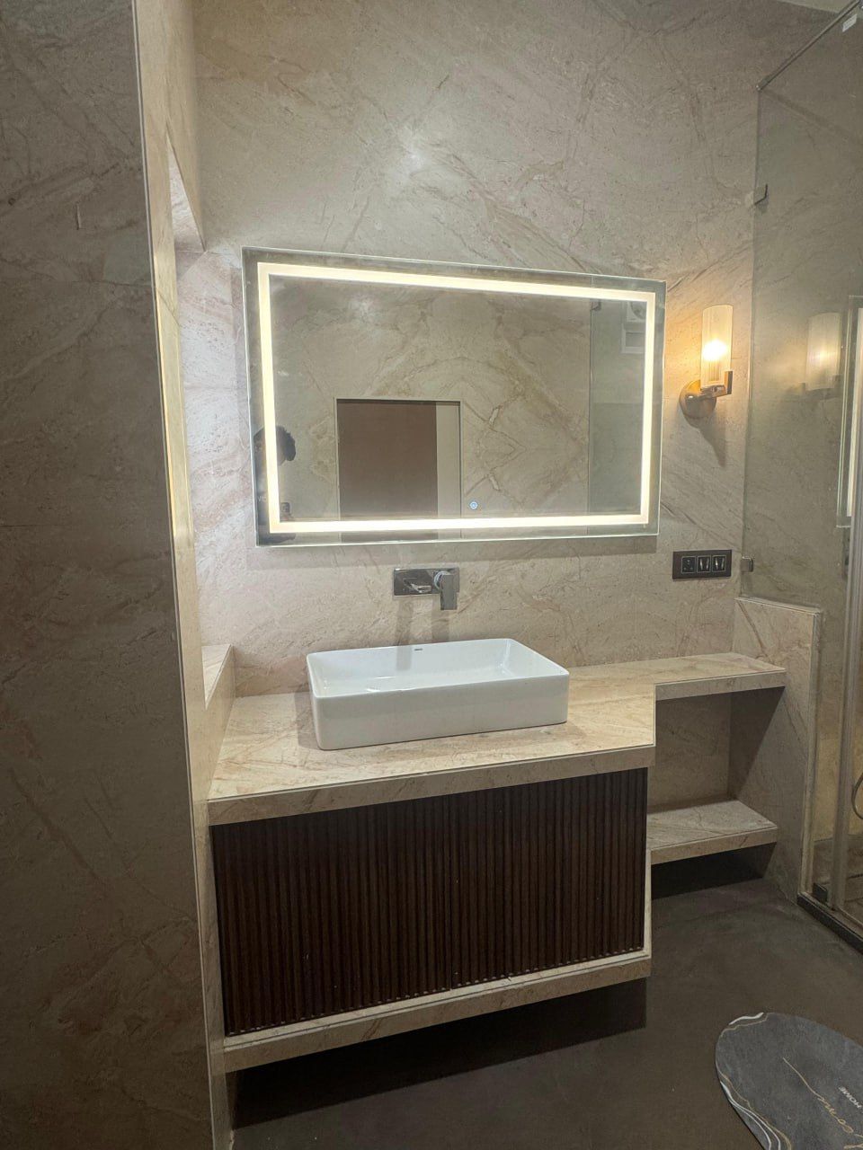 Elegant Vanity with Backlit Mirror and Custom Storage