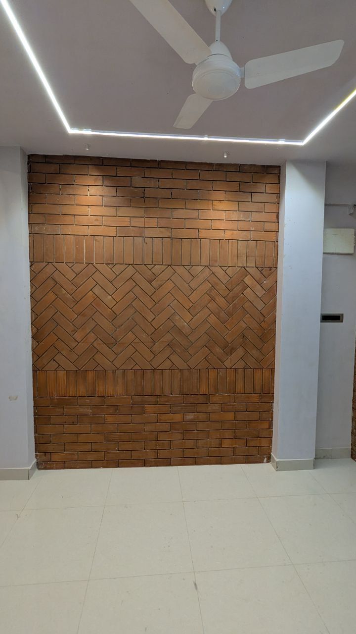 Completed Brick Feature Wall with Modern Geometric LED Ceiling