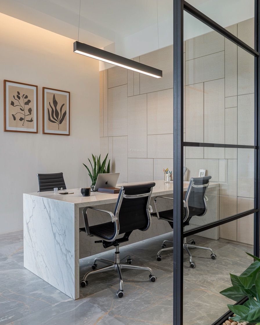 Minimalist Office Space with Marble Desk and Botanical Art