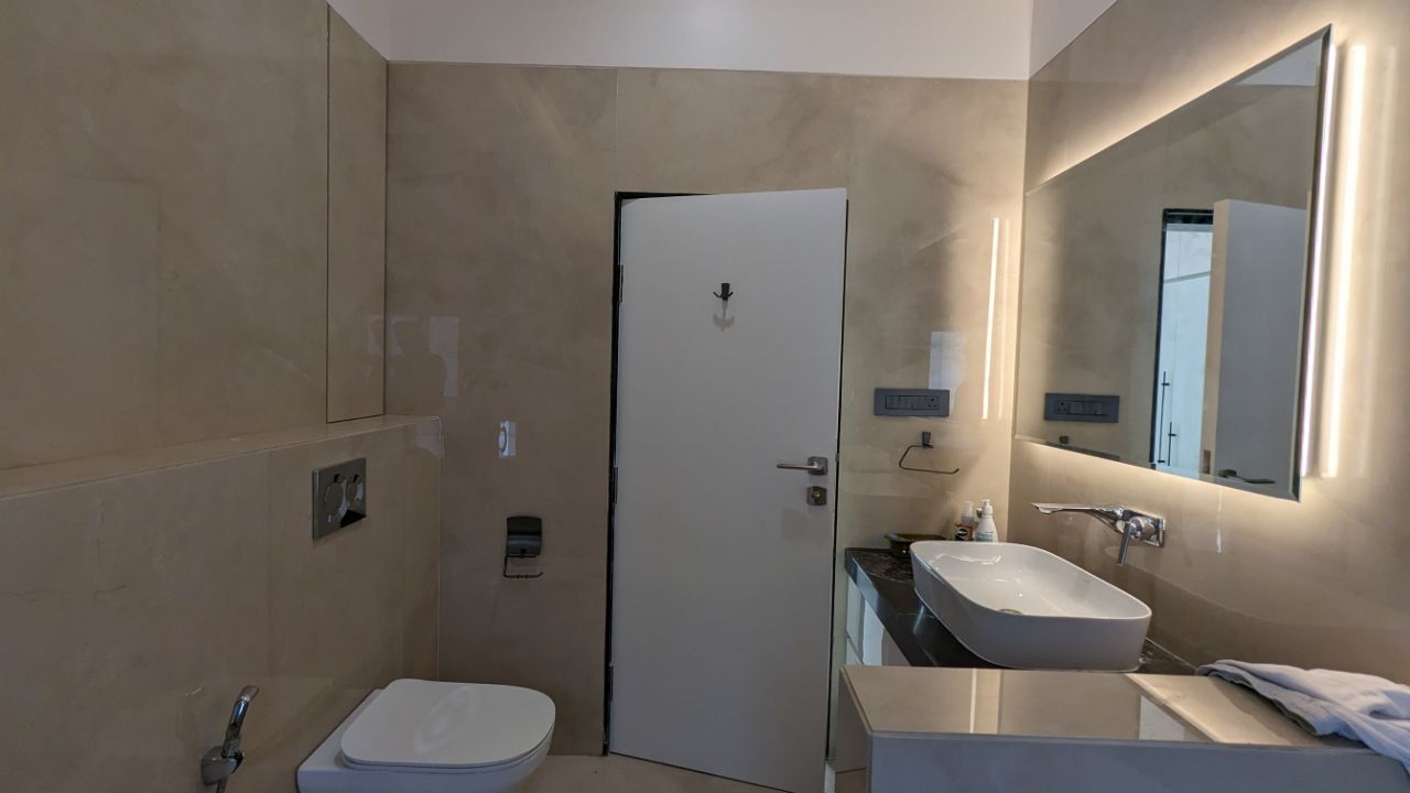 Minimalist Bathroom with Backlit Mirror Design